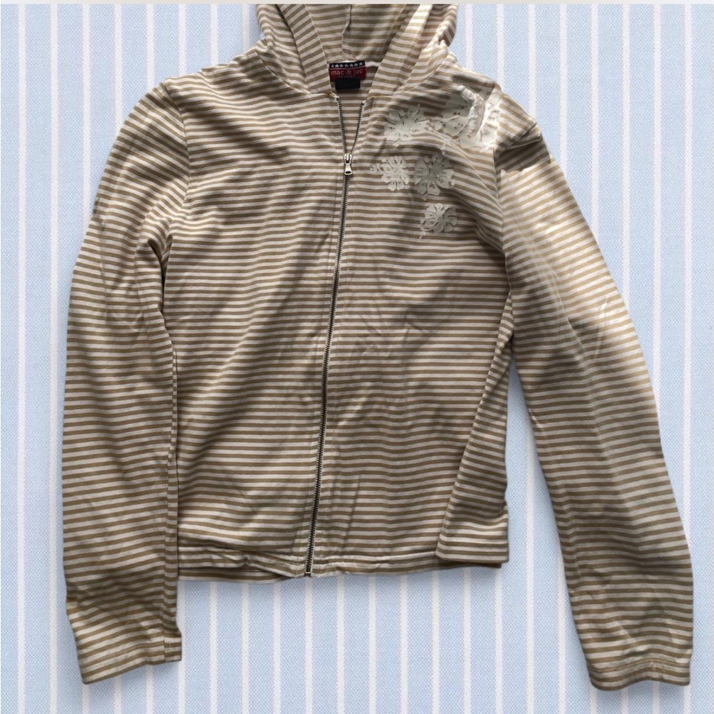Tan and white striped zip up hoodie with white hibiscus flower detail
